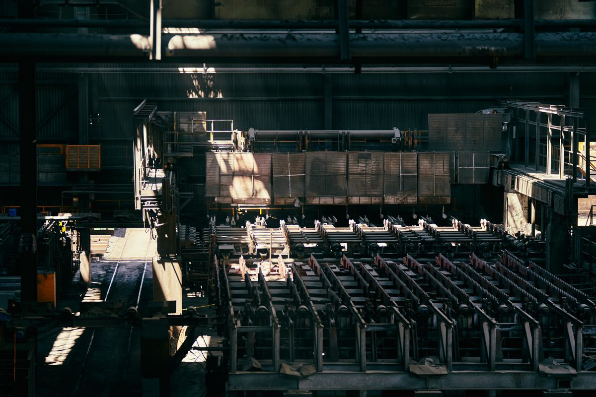 Aluminium extrusion factory interior with production machinery for bifold door profiles