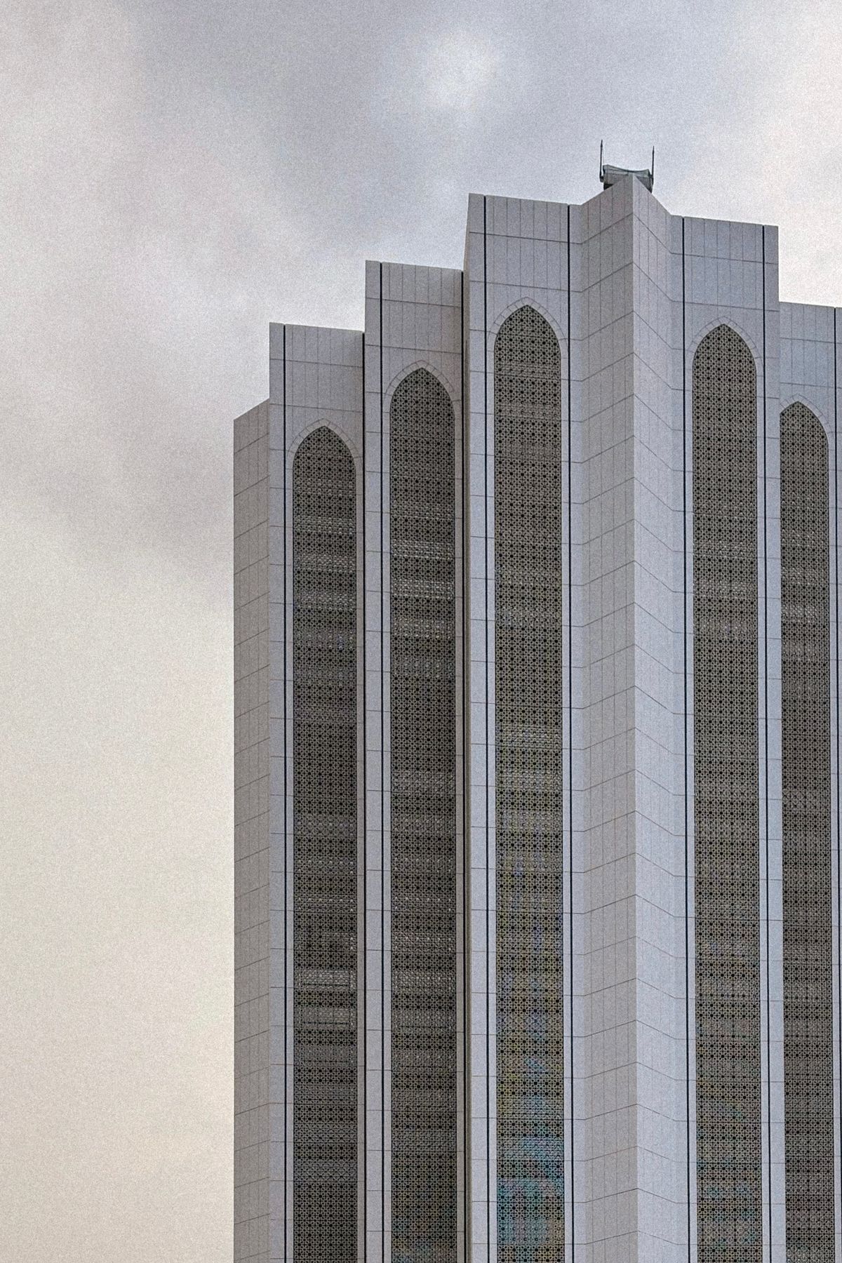 Modern high-rise building facade with rows of aluminium casement windows