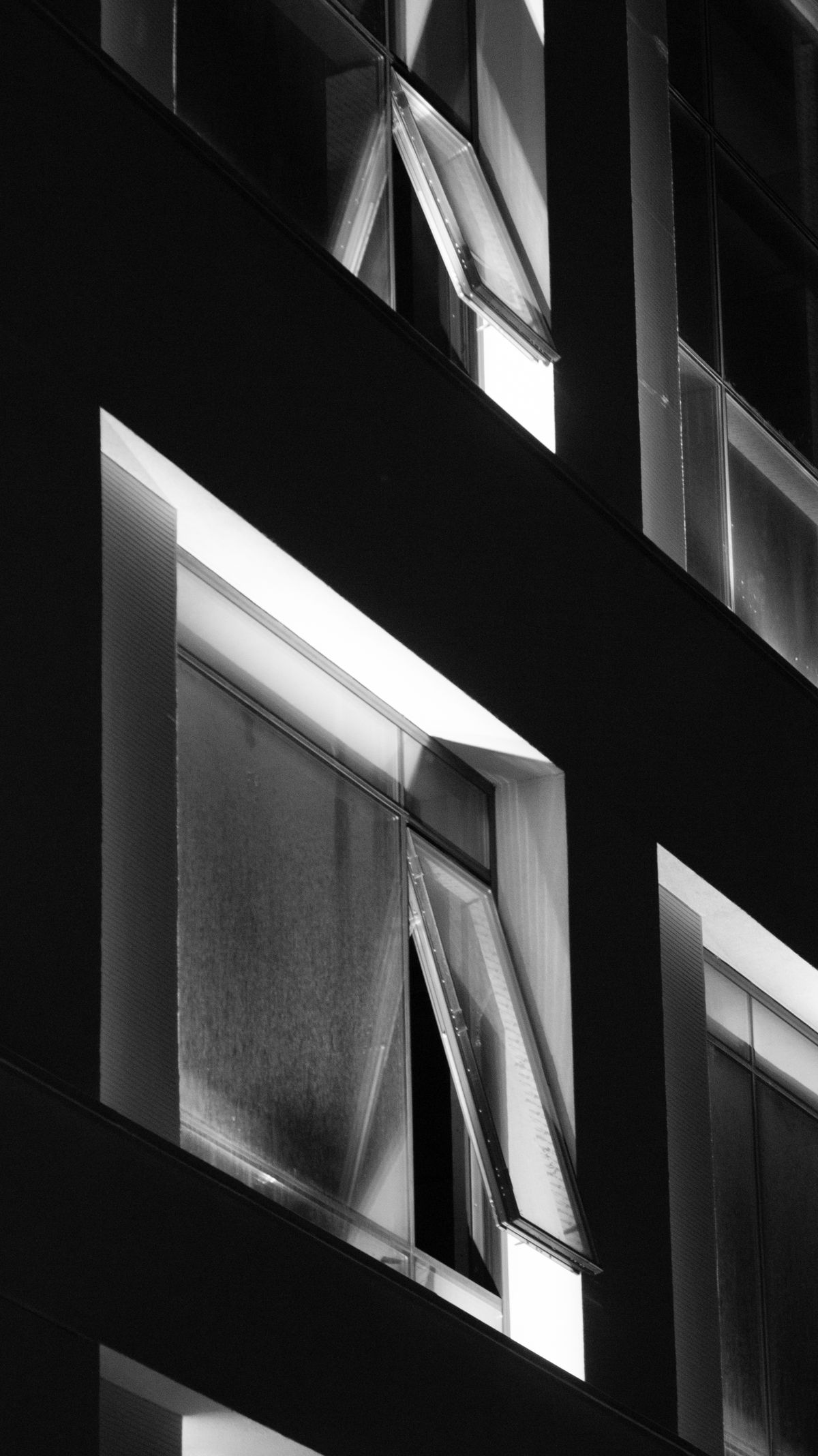 Windows in tilt position providing secure ventilation on a building
