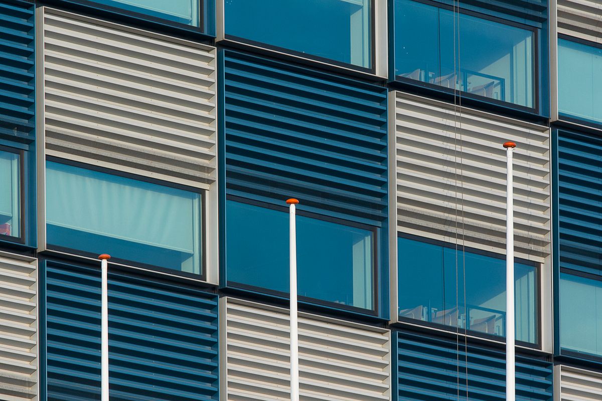 Modern office building with aluminium louvre windows for natural ventilation