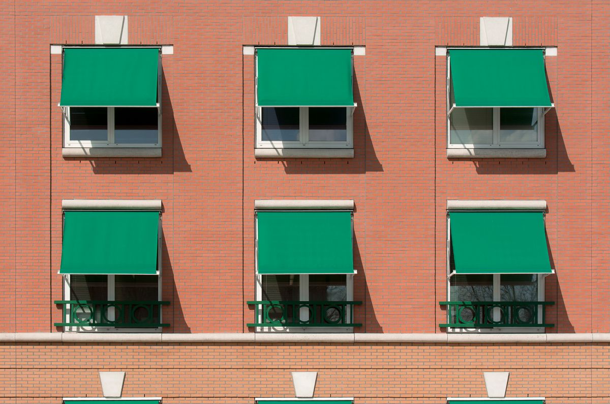 Residential building with aluminium awning windows for ventilation