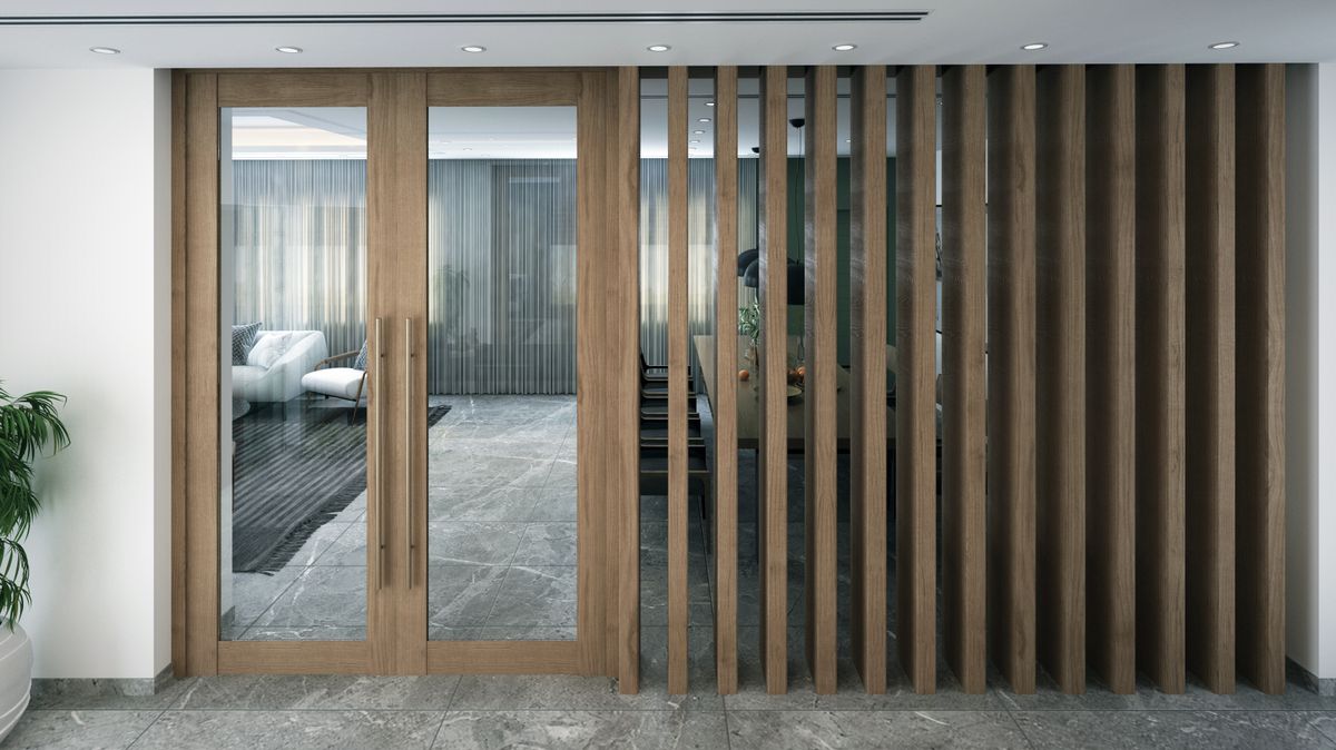Large glazed aluminium doors with wood-effect finish in a modern interior