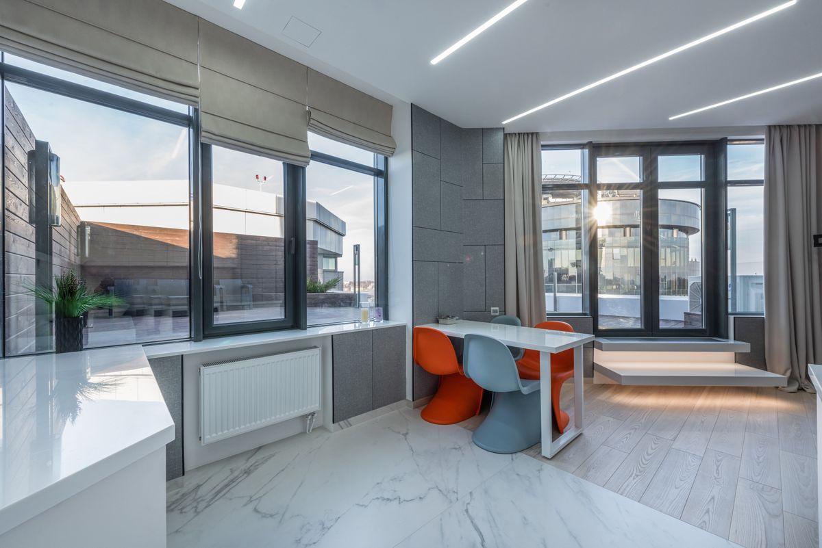 Modern home interior with slim aluminium double glazed windows and natural light